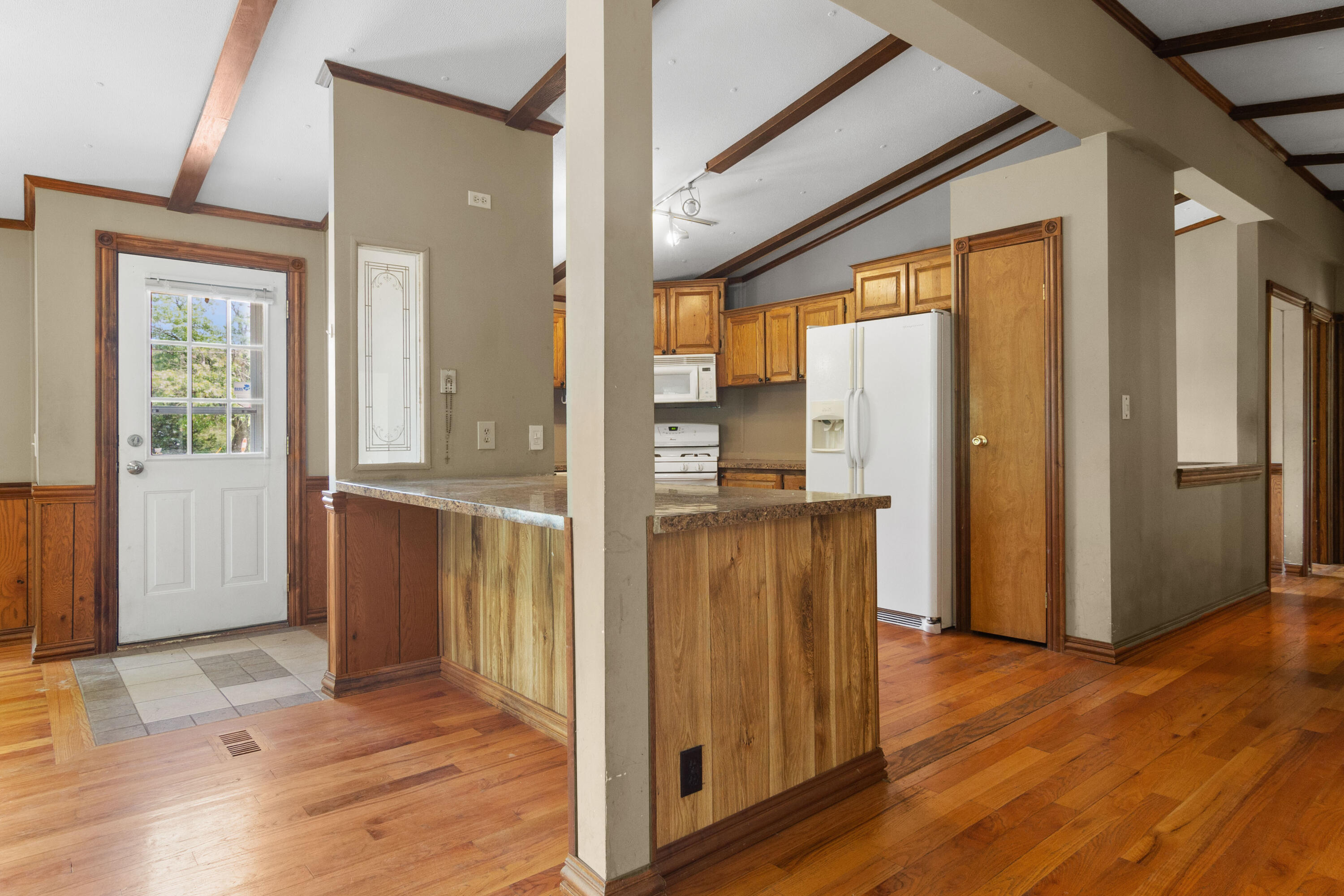 23102 Pierce Street Lowell, IN 46356 - Photo 12 of 32 a view of a hallway with wooden floor and staircase