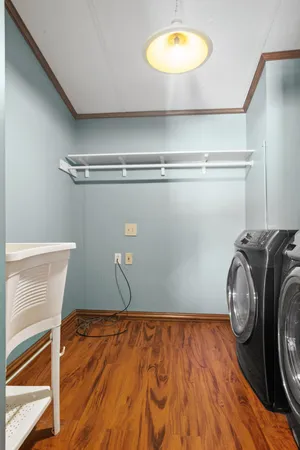 a view of a room with wooden floor