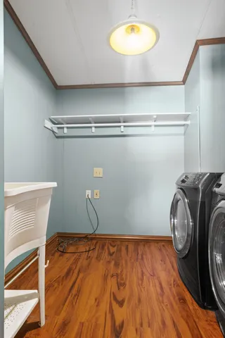 a view of a room with wooden floor