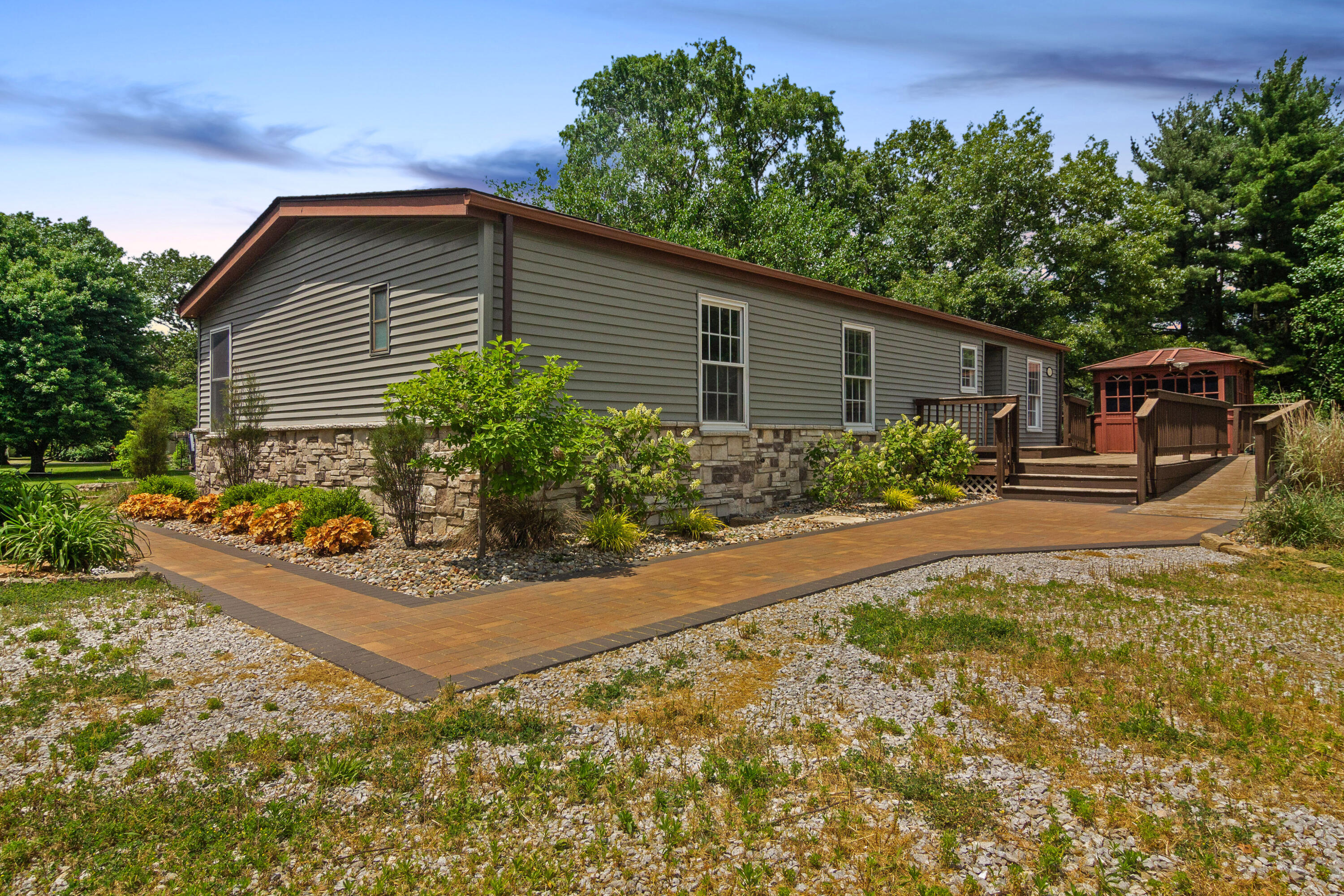 23102 Pierce Street Lowell, IN 46356 - Photo 2 of 32 a front view of a house with garden