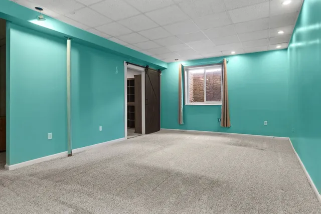 a view of an empty room with closet and yard