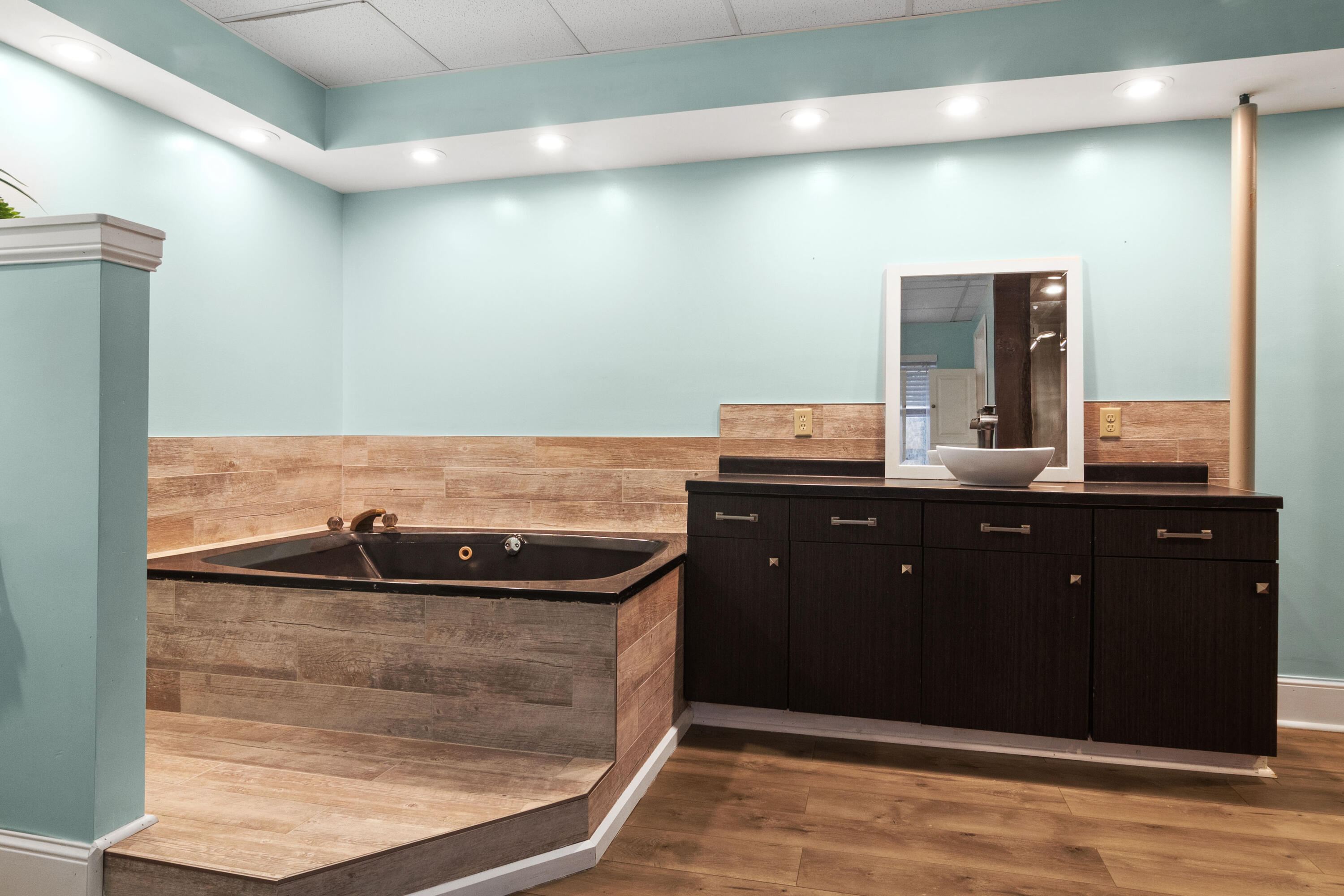 23102 Pierce Street Lowell, IN 46356 - Photo 26 of 32 a bathroom with a sink and a mirror