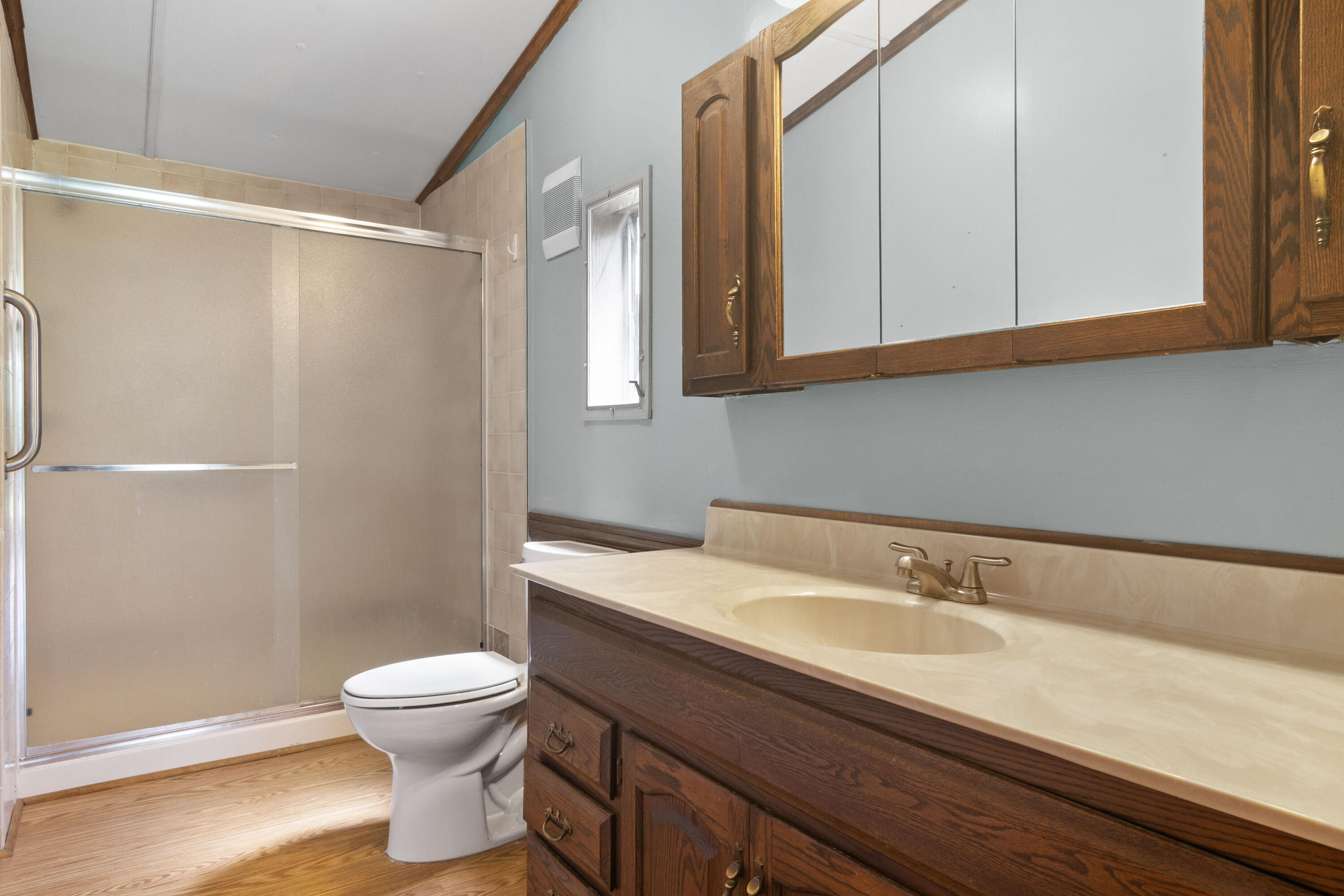 23102 Pierce Street Lowell, IN 46356 - Photo 27 of 32 a bathroom with a sink a toilet and a mirror