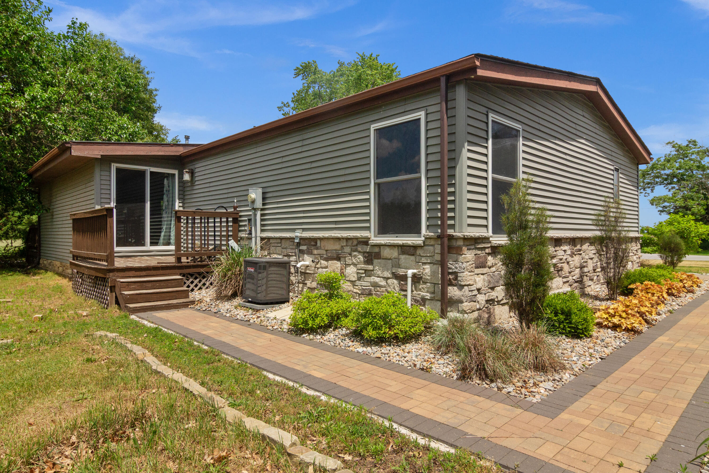 23102 Pierce Street Lowell, IN 46356 - Photo 3 of 32 a front view of a house with garden