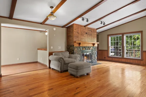 a living room with furniture and a fireplace