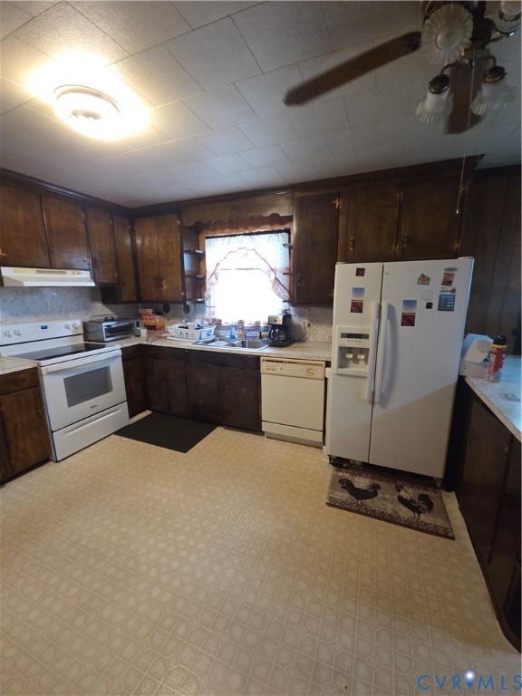 238 Purdy Road Emporia, VA 23847 - Photo 2 of 7 Kitchen featuring dark wood cabinetry, white appli