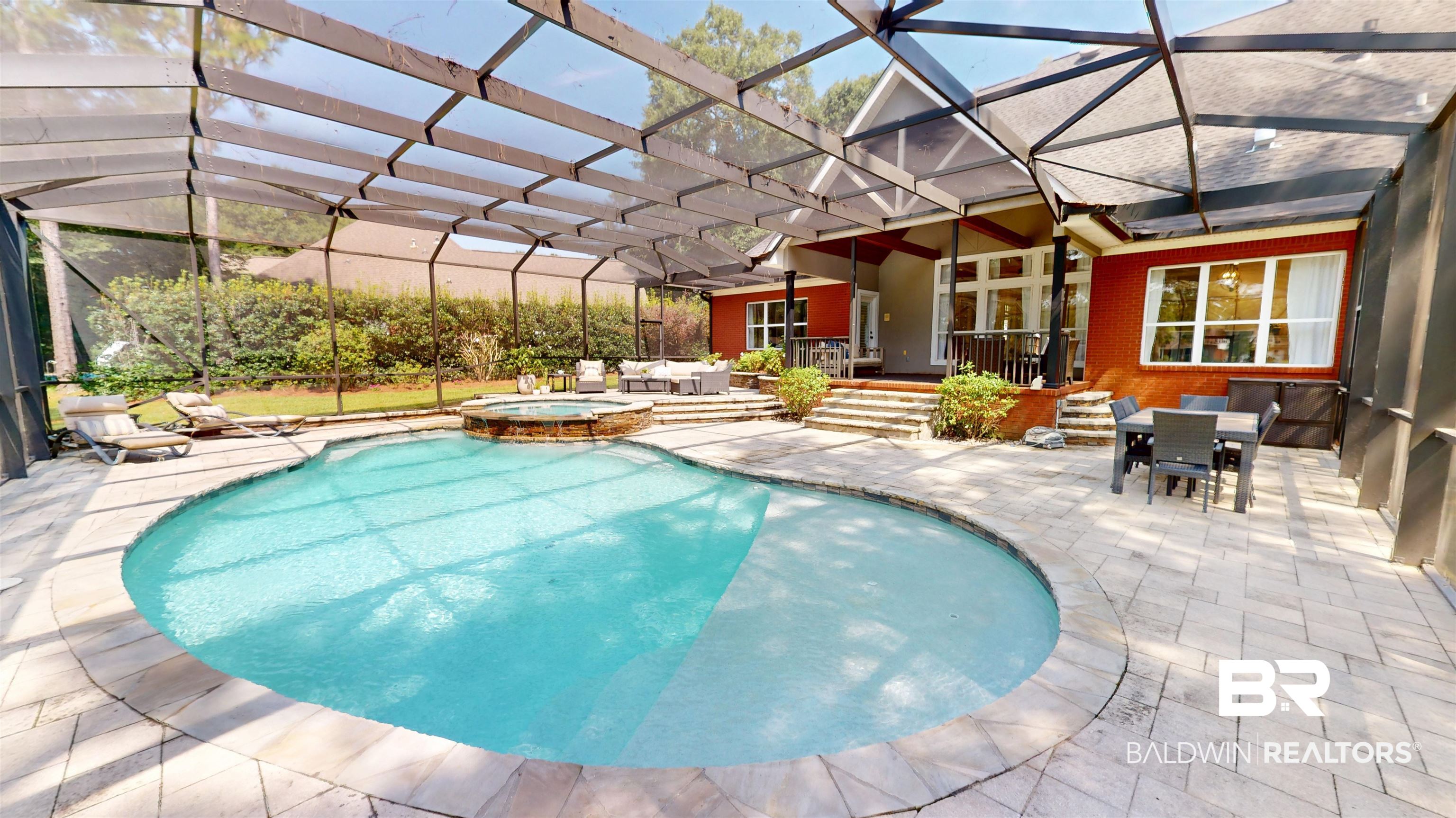 8775 Dawes Lake Road North Mobile, AL 36619 - Photo 42 of 59 View of swimming pool with a patio, outdoor dining area, and a pool with connected hot tub