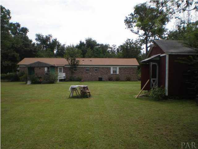 View of Back of House with workshop in the foreground
