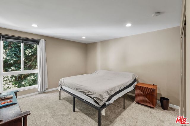 a room with a bed and a window