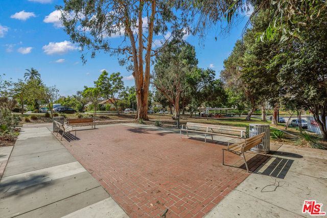 a view of a park with swings and slides