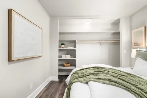 a bedroom with a bed and a window