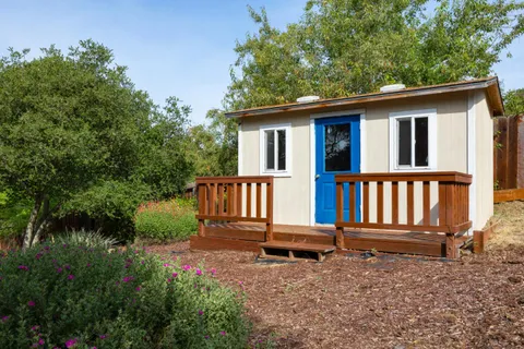 front view of a house with a yard