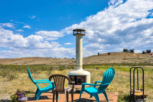 a view of a chairs and table in the terrace