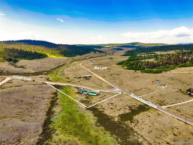 a view of house with a swimming pool