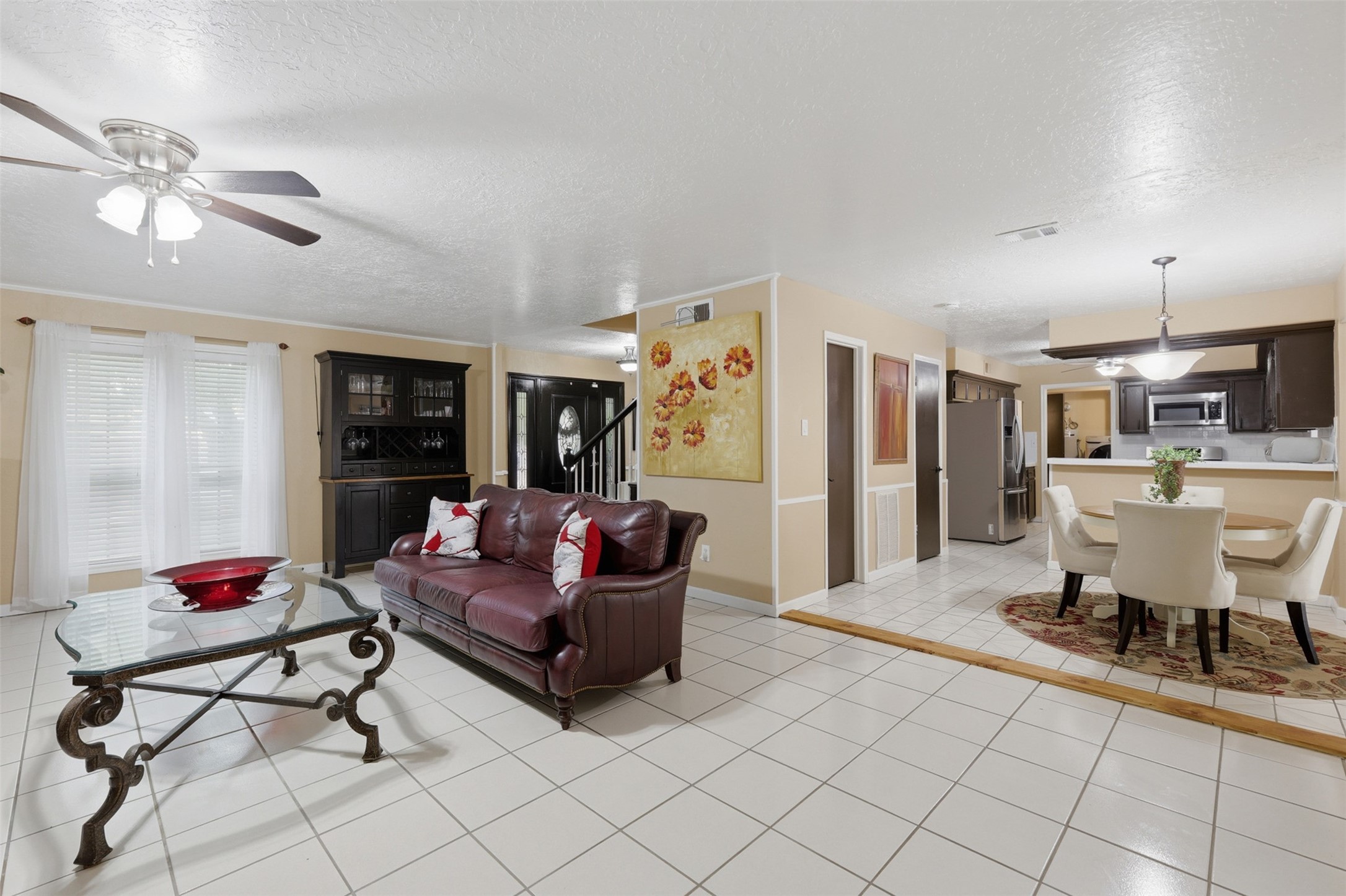 7010 River Mill Drive Spring, TX 77379 - Photo 9 of 29 a living room with furniture and a chandelier
