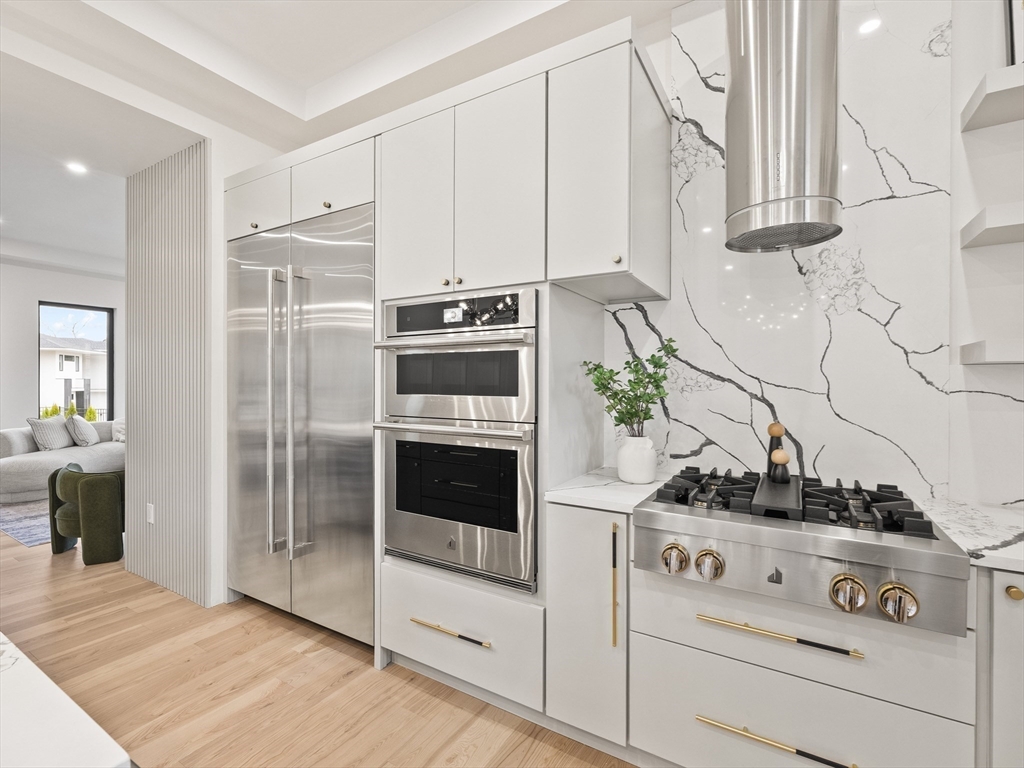 225 Walnut Street Saugus, MA 01906 - Photo 15 of 42 a kitchen with white cabinets and appliances