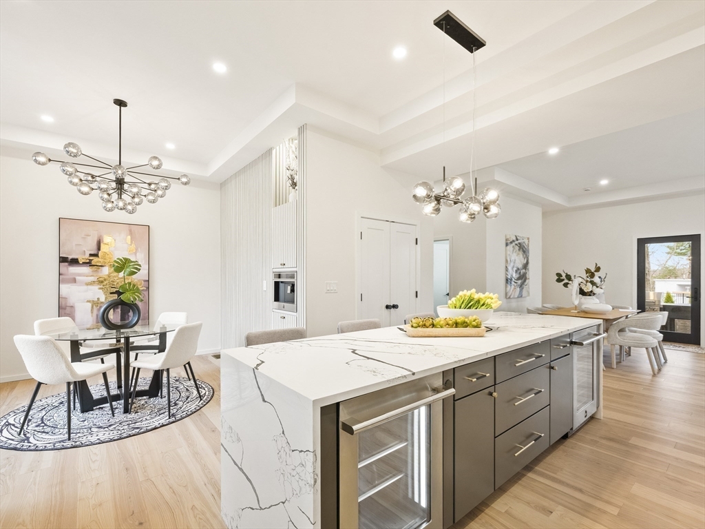 225 Walnut Street Saugus, MA 01906 - Photo 16 of 42 a kitchen with a sink a counter space and a dining table
