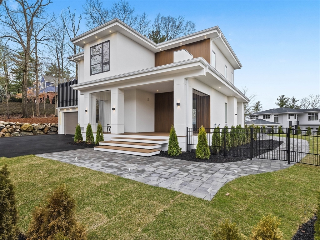 225 Walnut Street Saugus, MA 01906 - Photo 2 of 42 a view of a white house with a small yard and large trees