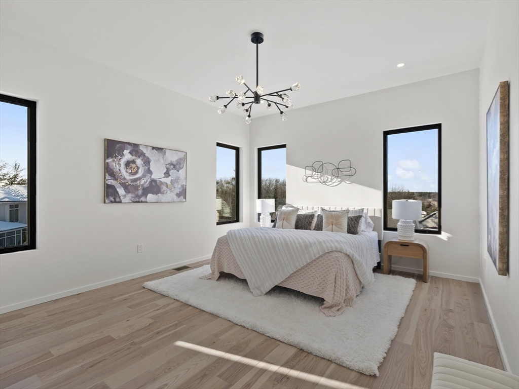 225 Walnut Street Saugus, MA 01906 - Photo 23 of 42 a spacious bedroom with a large bed and a window