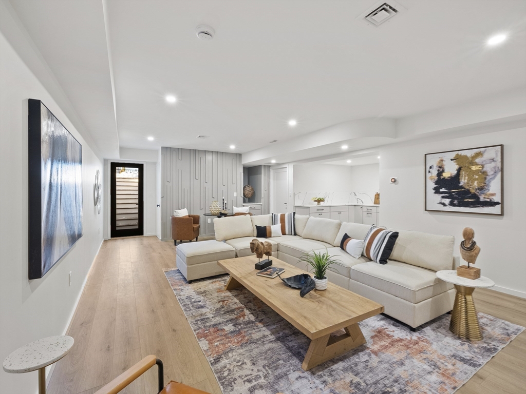 225 Walnut Street Saugus, MA 01906 - Photo 30 of 42 a living room with furniture and a rug
