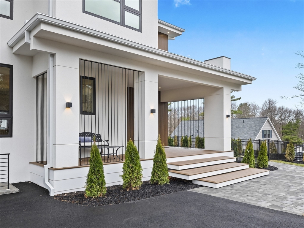 225 Walnut Street Saugus, MA 01906 - Photo 3 of 42 a front view of a house with a garden