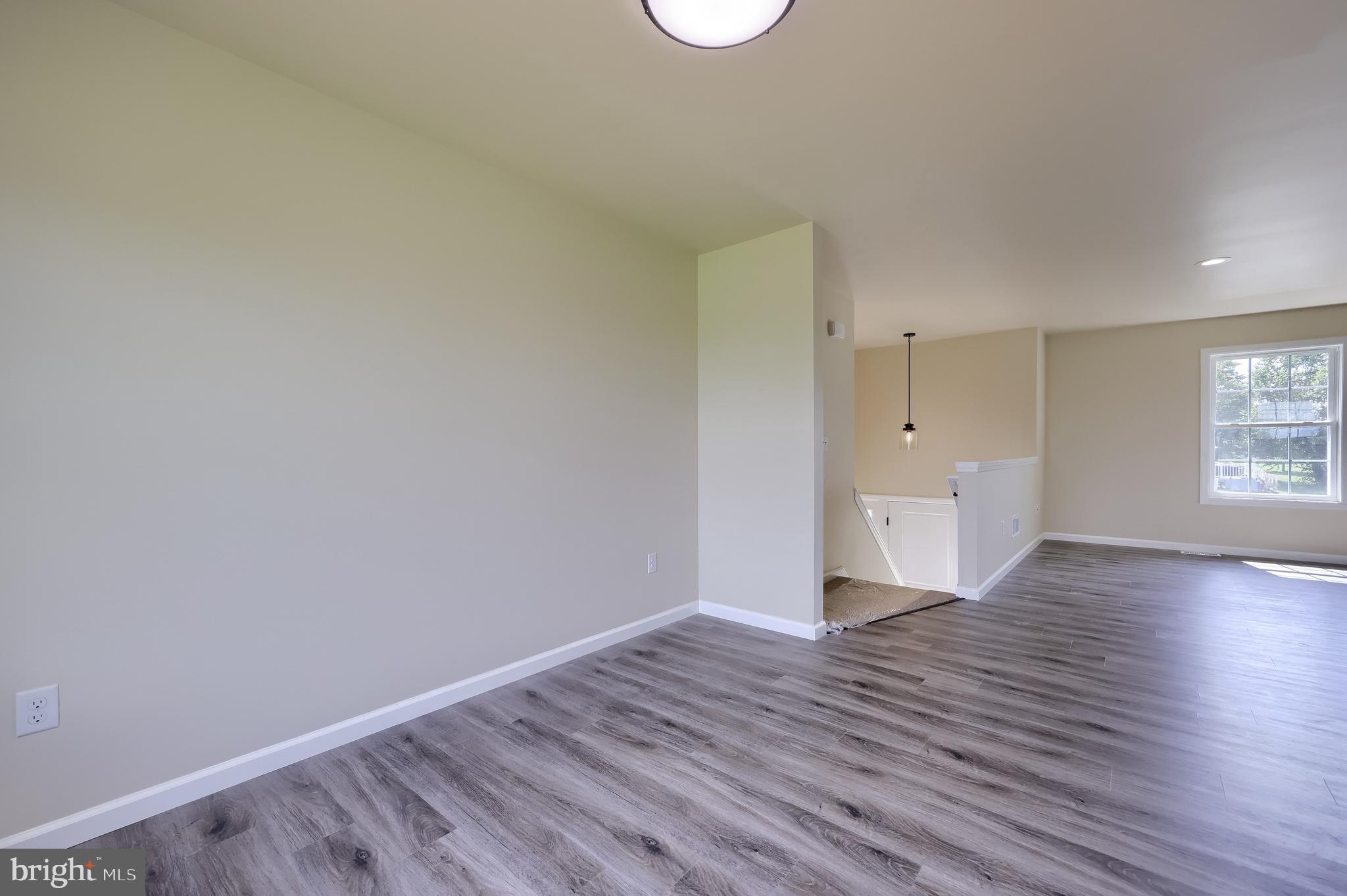 6030 Deborah Drive Spring Grove, PA 17362 - Photo 11 of 34 a view of a room with wooden floor and windows
