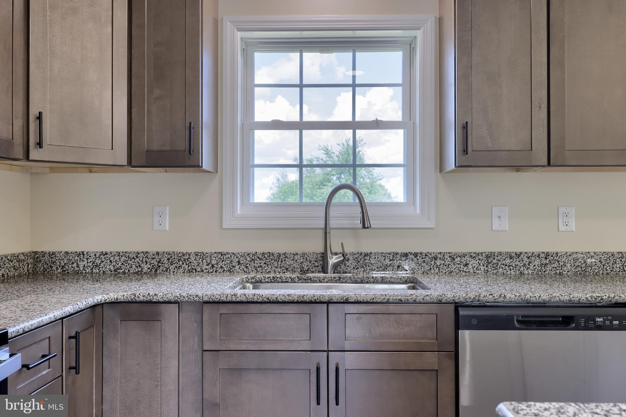 6030 Deborah Drive Spring Grove, PA 17362 - Photo 16 of 34 a kitchen with granite countertop a sink and cabinets