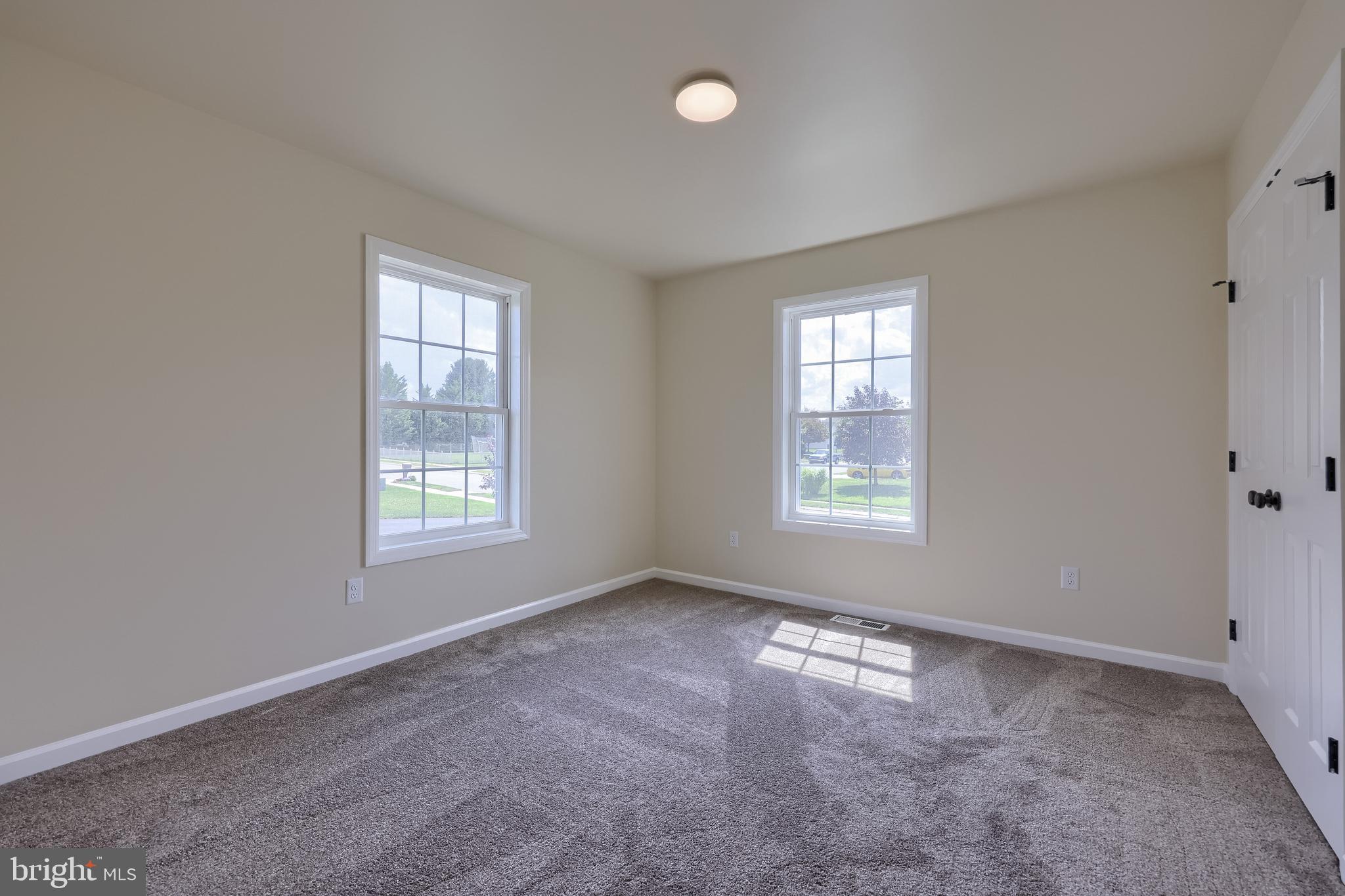 6030 Deborah Drive Spring Grove, PA 17362 - Photo 21 of 34 a view of a big room with windows and chandelier fan