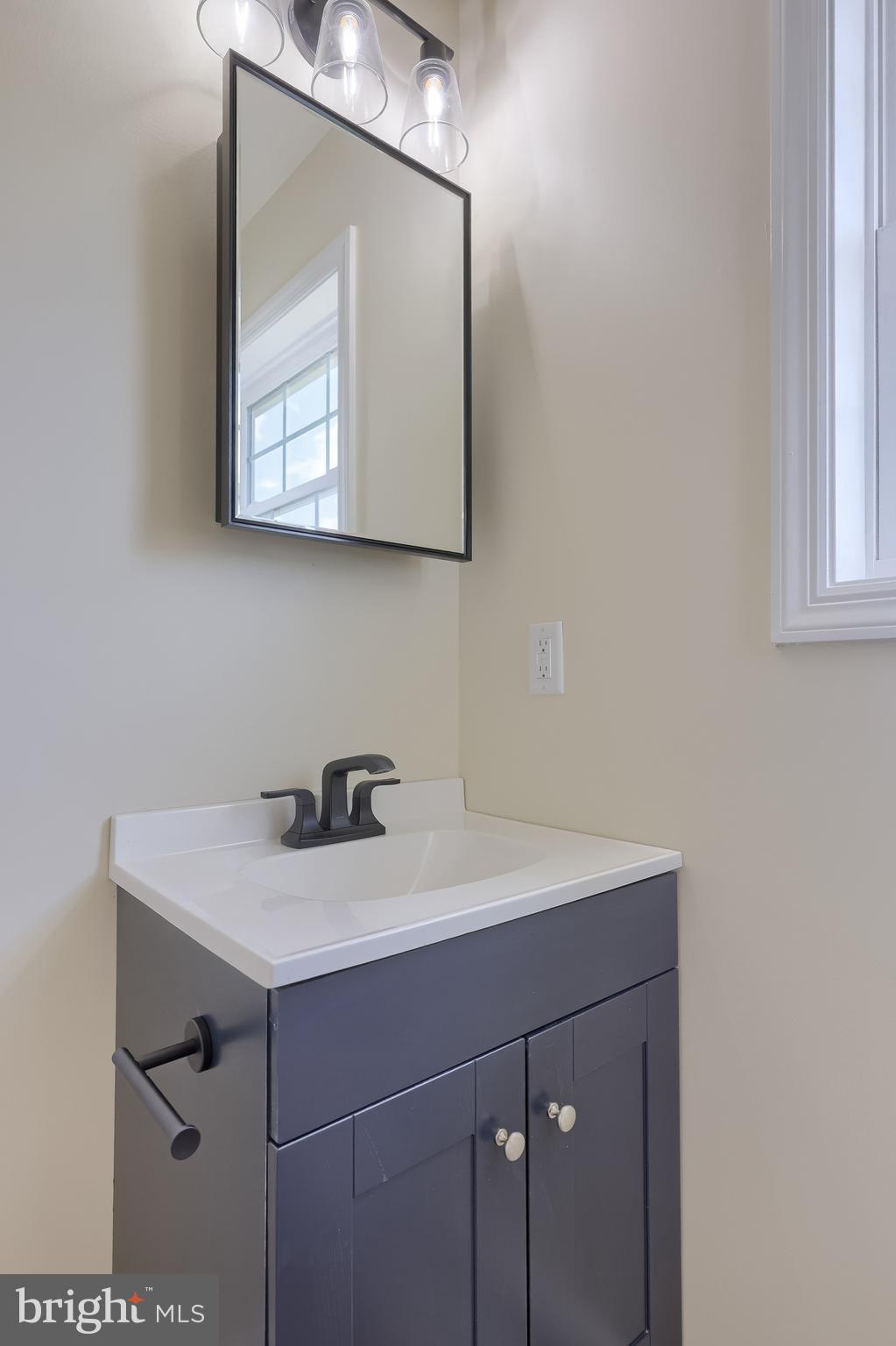 6030 Deborah Drive Spring Grove, PA 17362 - Photo 25 of 34 a bathroom with a sink vanity and a mirror