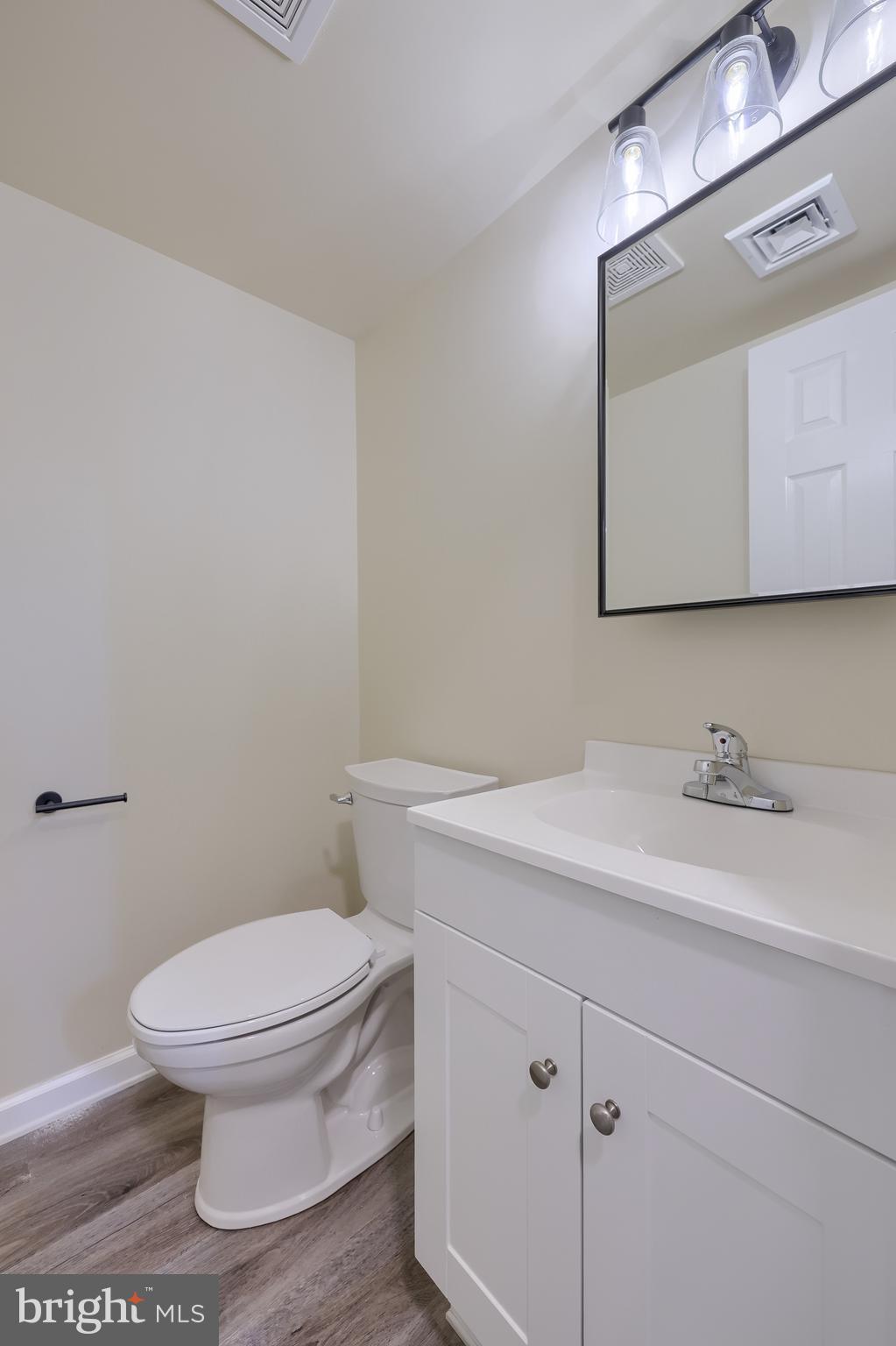 6030 Deborah Drive Spring Grove, PA 17362 - Photo 26 of 34 a bathroom with a toilet sink vanity and mirror