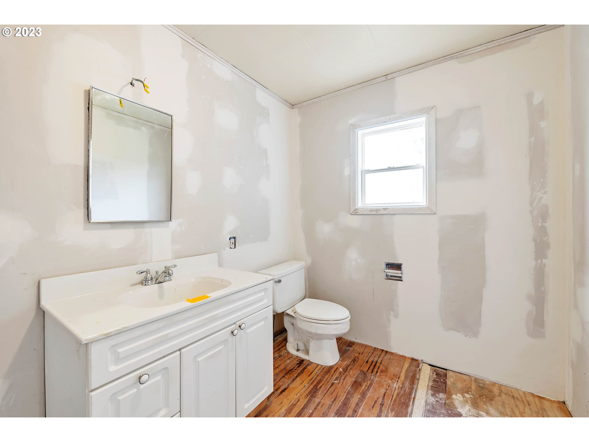 92010 Marcola Road Springfield, OR 97478 - Photo 15 of 45 a bathroom with a sink toilet a mirror and vanity