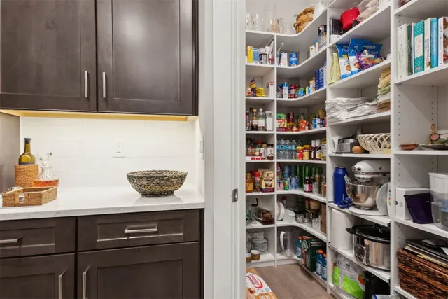 a living room with a bed furniture and a window