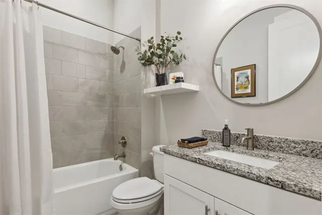 a bedroom with a bed and a chair