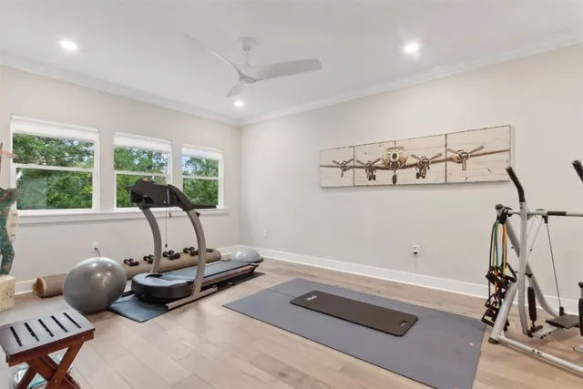 a bathroom with a granite countertop double vanity sink and a mirror