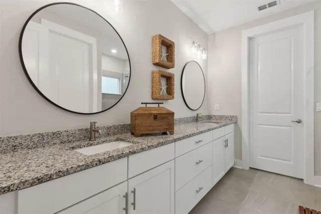 a view of a backyard with table and chairs and potted plants