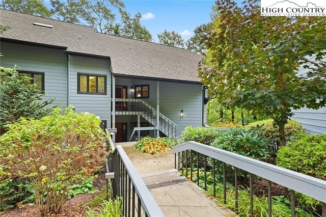 a view of a pathway in front of house