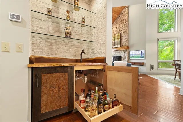 a view of a room with window and wooden floor