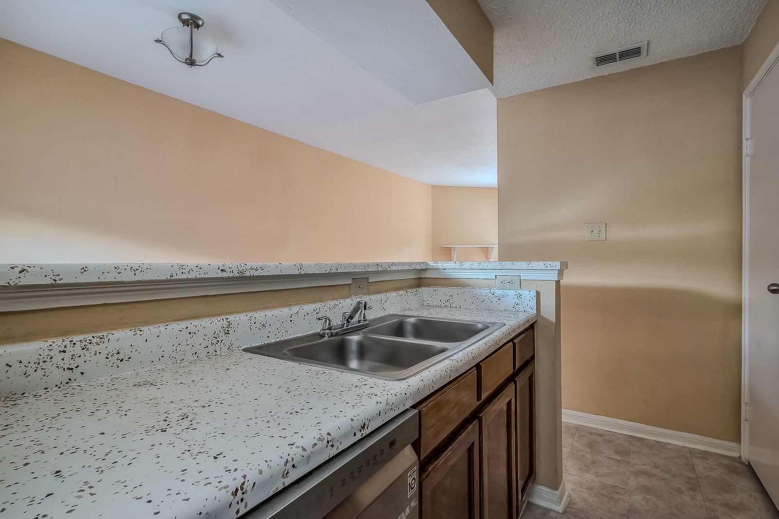 11201 Lynbrook Drive, Unit 3202 Houston, TX 77042 - Photo 14 of 22 a kitchen with a sink and cabinets