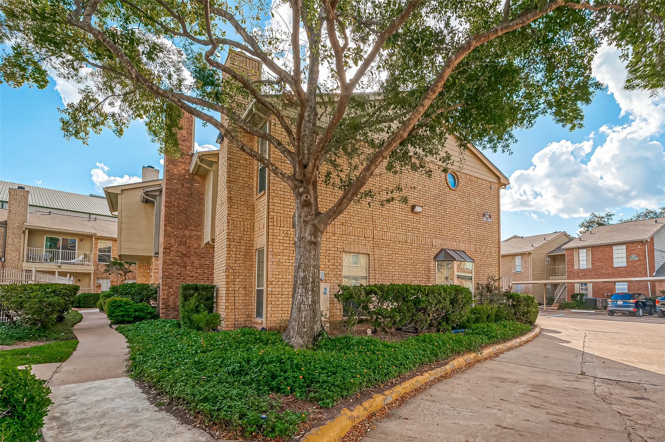 11201 Lynbrook Drive, Unit 3202 Houston, TX 77042 - Photo 2 of 22 a view of a building with a yard