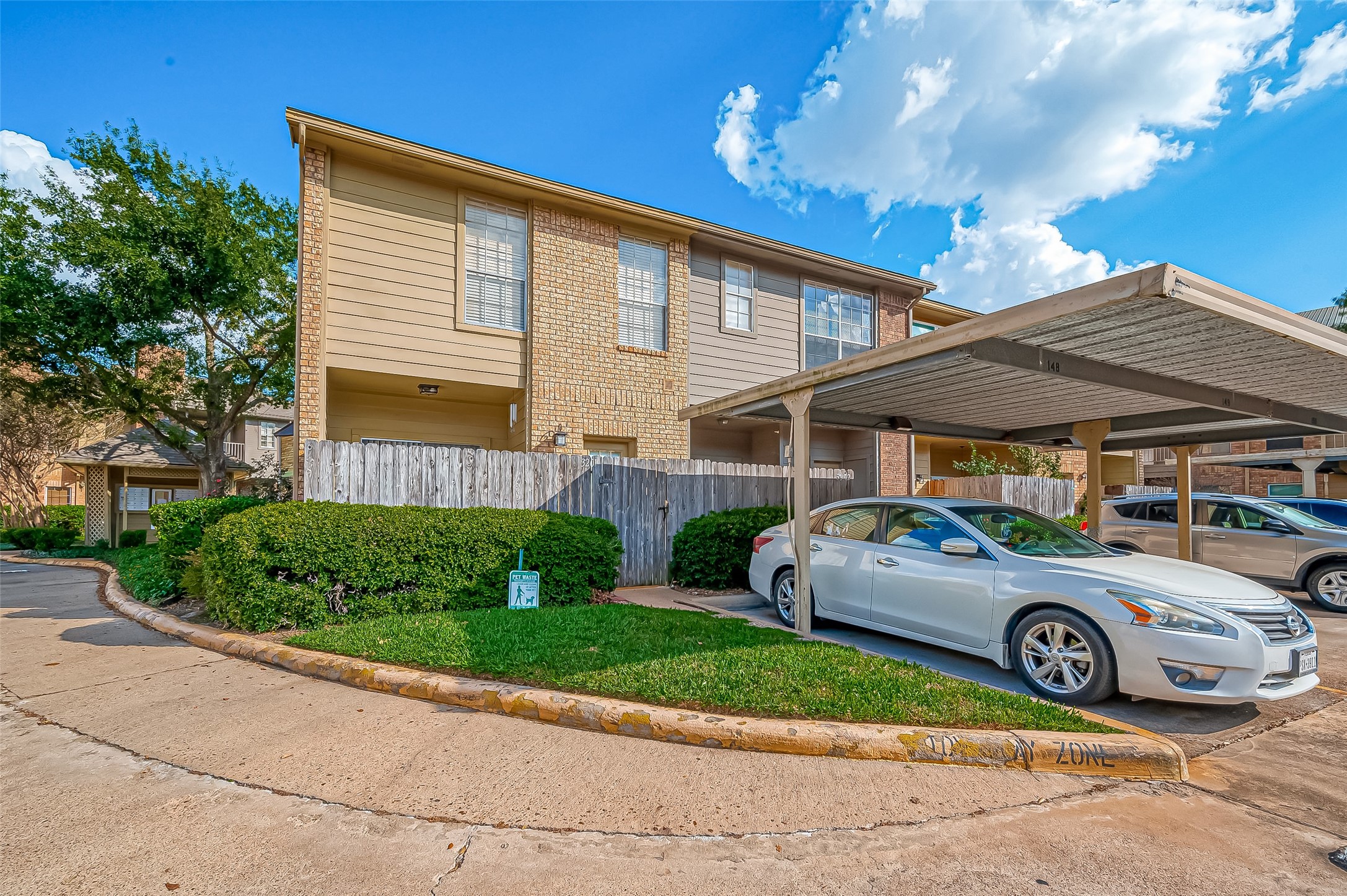 11201 Lynbrook Drive, Unit 3202 Houston, TX 77042 - Photo 22 of 22 a car parked in front of a house