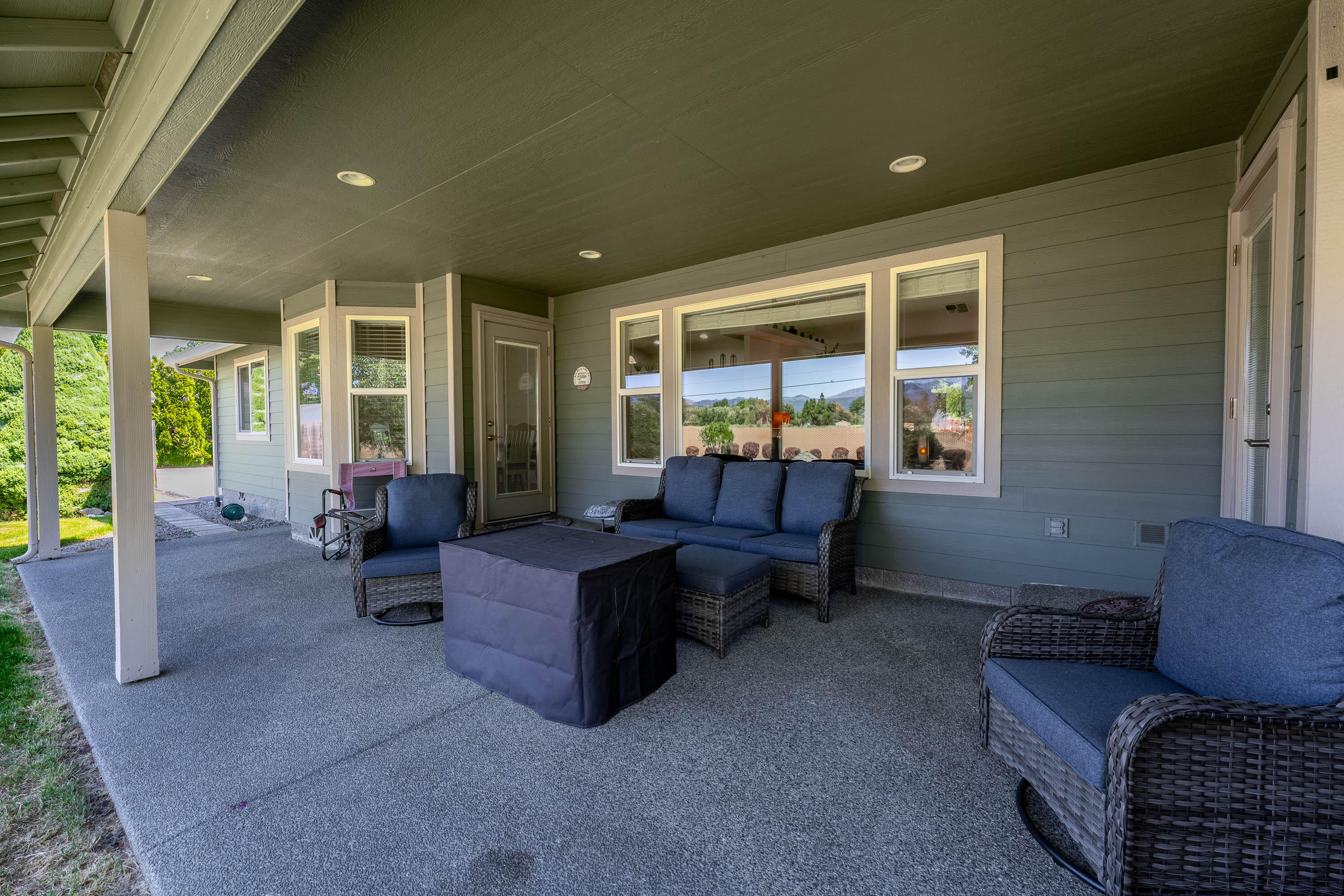 974 Felicia Lane Grants Pass, OR 97527 - Photo 21 of 36 a living room with furniture and a floor to ceiling window