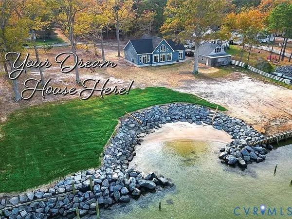a view of a street with a bench and trees