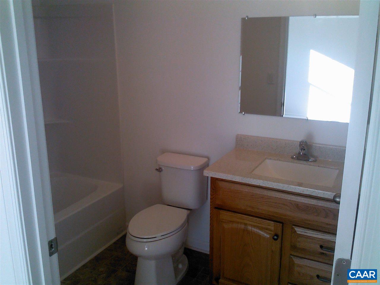 130 Jacoby Road Louisa, VA 23093 - Photo 12 of 12 a bathroom with a sink a toilet and a mirror