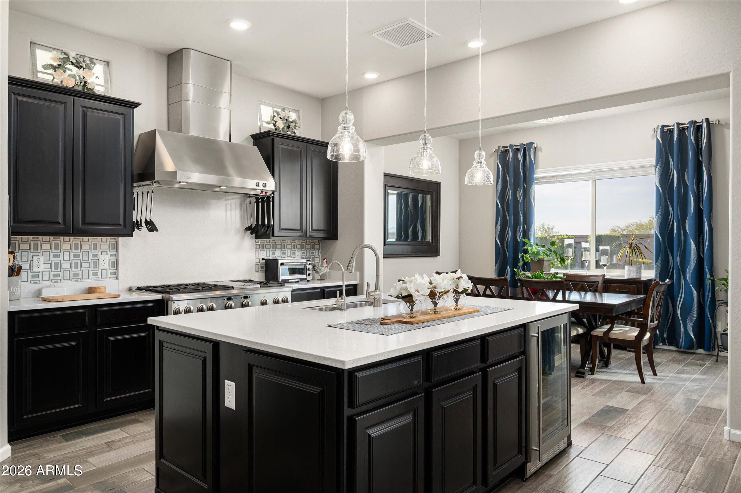 6406 Copper Springs Road Phoenix, AZ 85083 - Photo 14 of 59 a kitchen with a sink stove and cabinets