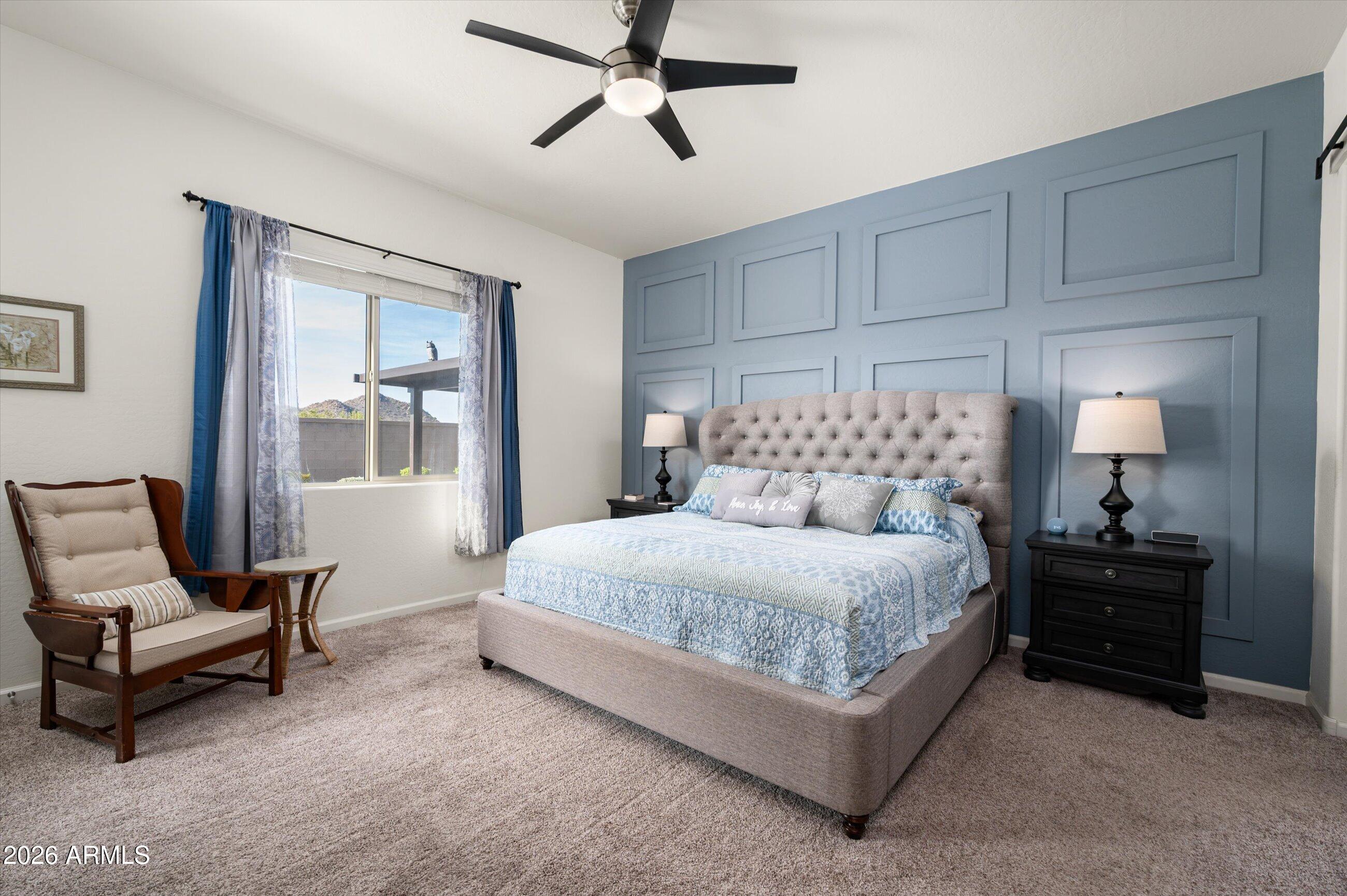 6406 Copper Springs Road Phoenix, AZ 85083 - Photo 19 of 59 a bedroom with a bed and window