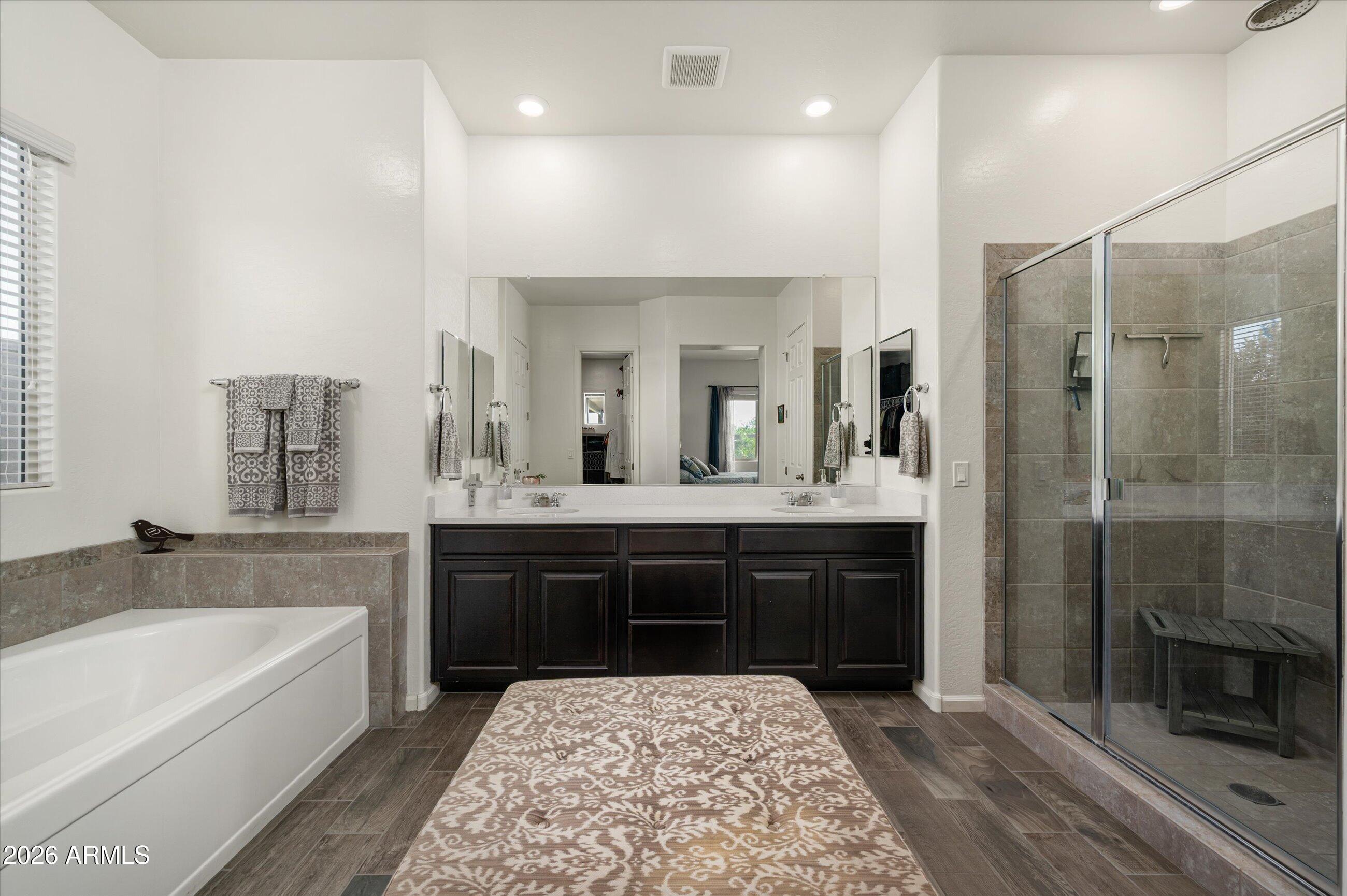 6406 Copper Springs Road Phoenix, AZ 85083 - Photo 21 of 59 a spacious bathroom with a tub sink shower and mirror