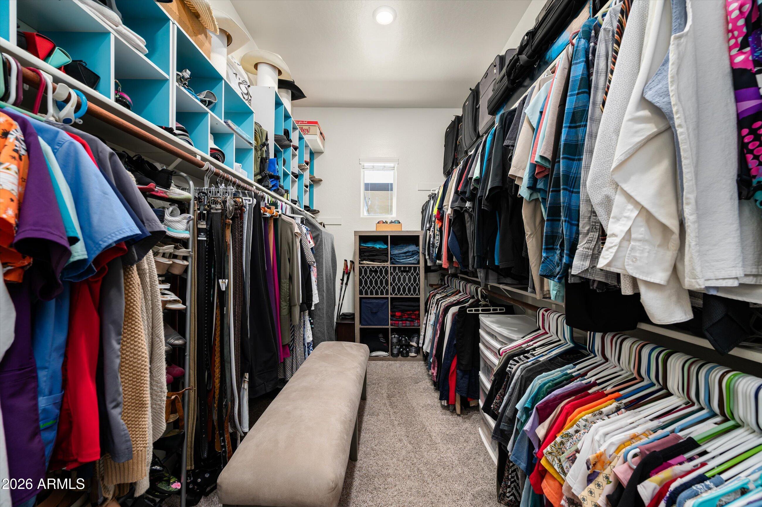 6406 Copper Springs Road Phoenix, AZ 85083 - Photo 23 of 59 a view of walk in closet with clothes and shoes