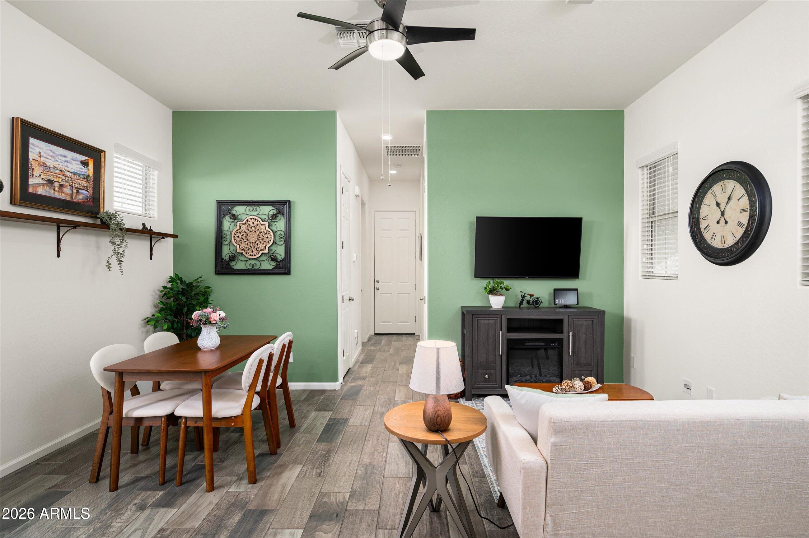 6406 Copper Springs Road Phoenix, AZ 85083 - Photo 27 of 59 a living room with furniture and a flat screen tv
