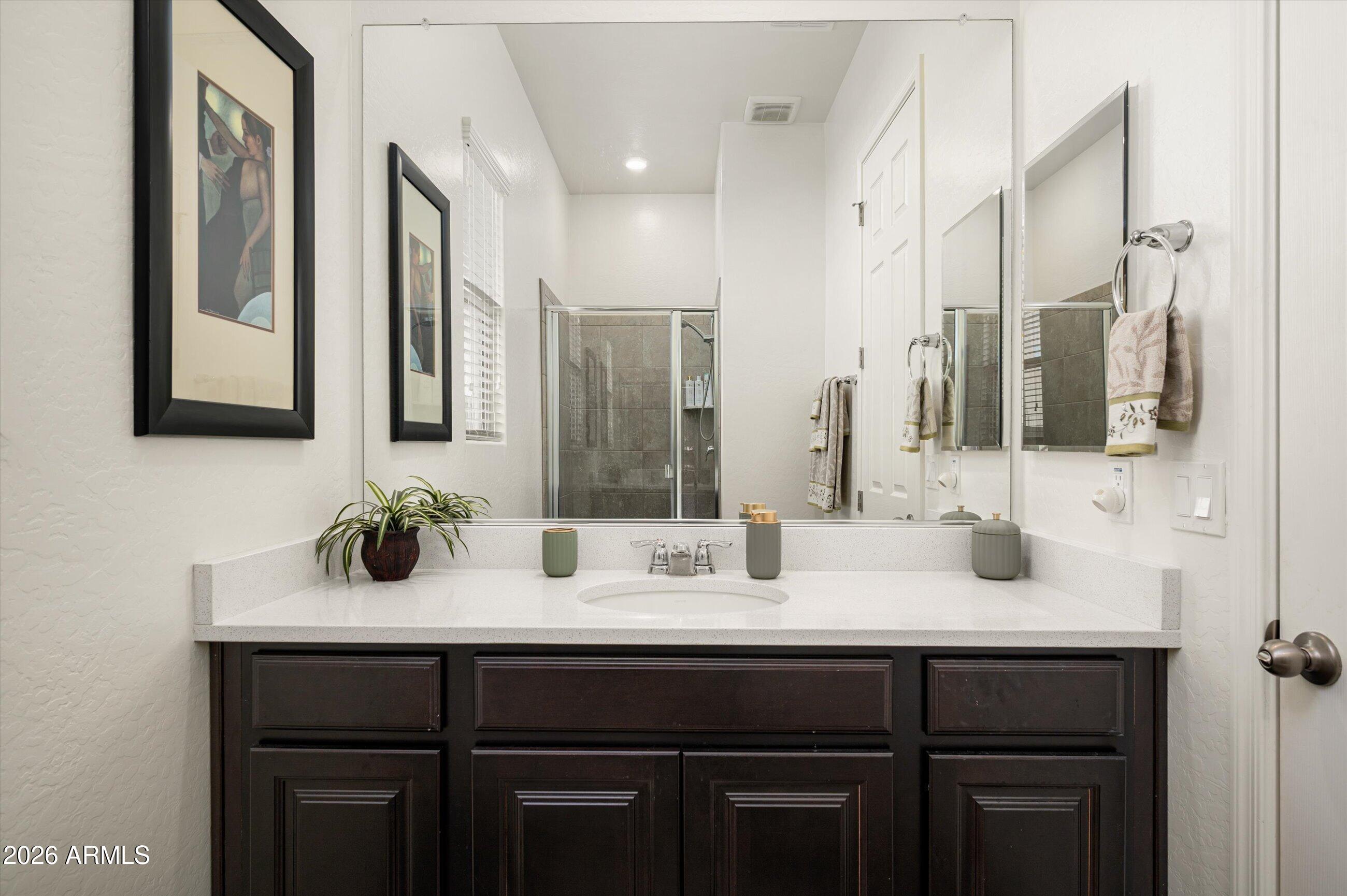 6406 Copper Springs Road Phoenix, AZ 85083 - Photo 29 of 59 a bathroom with a sink double vanity and a mirror