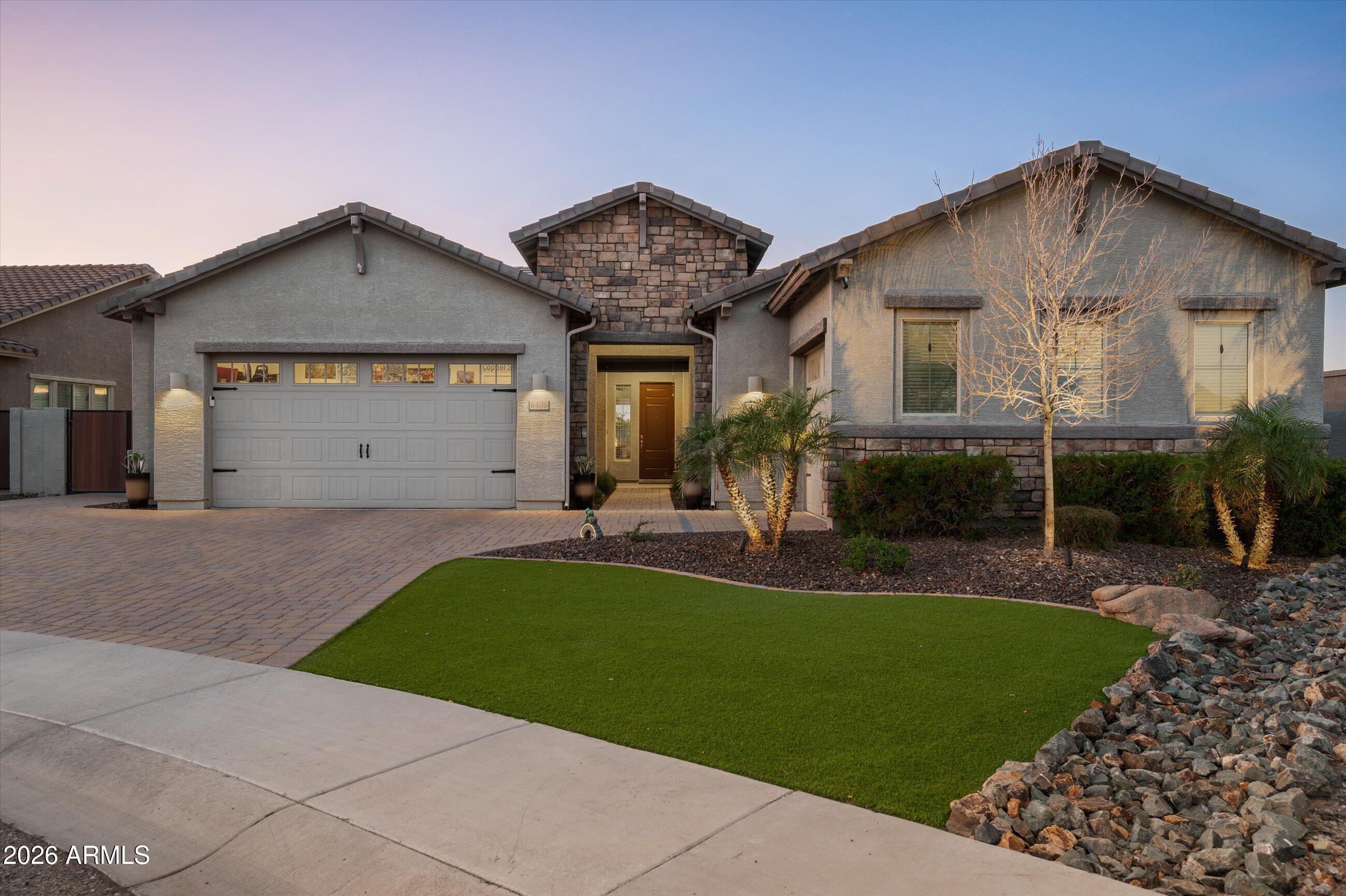 6406 Copper Springs Road Phoenix, AZ 85083 - Photo 2 of 59 a view of a house with a yard plants and a table and chairs